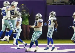 Jugadores de los Cowboys celebran anotación