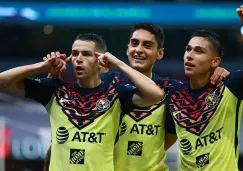 Jugadores de América festejan un gol