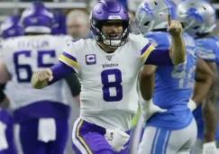 Kirk Cousins celebrando una anotación con Vikings