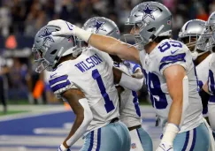 Jugadores de Dallas celebran TD frente a Eagles