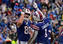 Sanders y Knox celebrando una anotación a favor