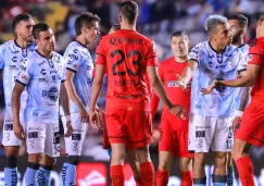 Jugadores de Querétaro y Toluca durante partido de la Liga MX