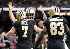 Tayson Hill celebrando su anotación con los Saints 