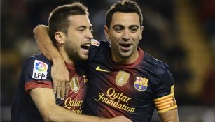 Jordi Alba y Xavi celebran un tanto del Barcelona