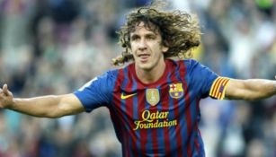 Puyol celebra una anotación con el Barcelona