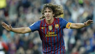 Carles Puyol celebrando un gol cuando jugaba en Barcelona