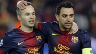 Andrés Iniesta y Xavi Hernández durante un partido del Barcelona