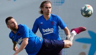 Griezmann y Messi en un entrenamiento con el Barcelona