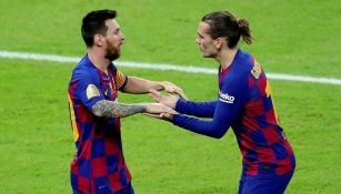 Messi y Griezmann durante un partido con Barcelona