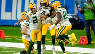 Jugadores de Packers celebran TD ante Lions