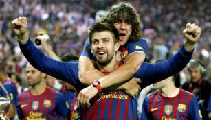 Piqué y Puyol celebrando un título del Barcelona