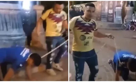 América: Aficionado cobró apuesta y puso 'de perrito' a fan de Cruz Azul