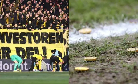 ¡Lluvia de dinero! Aficionados de Colonia protestaron lanzando monedas de chocolate al terreno de juego