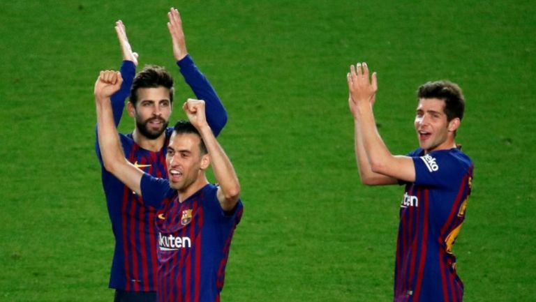 Piqué, Busquets y Sergi Roberto festejan tras un triunfo del Barça