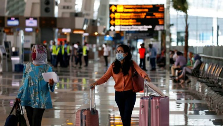 Pasajeros en Aeropuerto