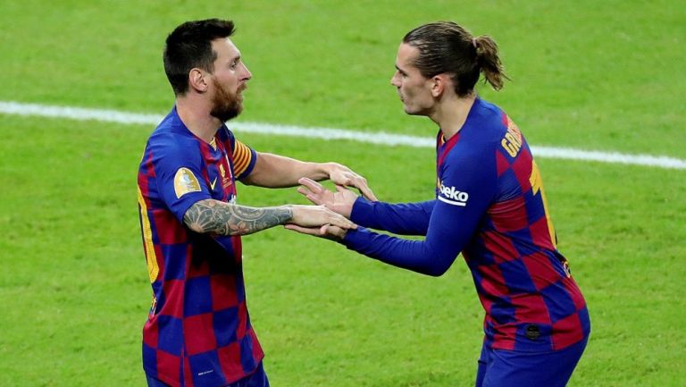 Messi y Griezmann durante un partido con Barcelona