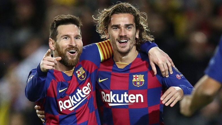 Griezmann y Messi durante un duelo con el Barcelona 