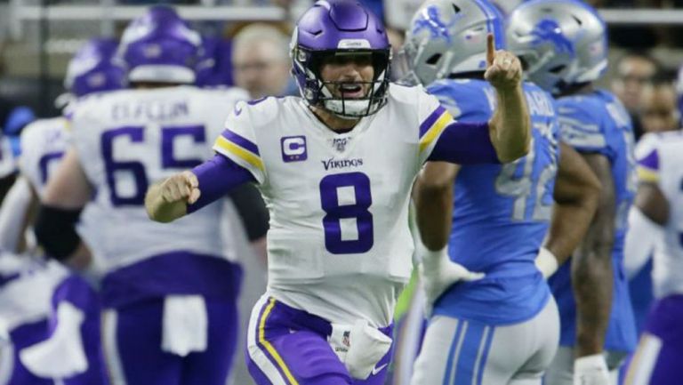 Kirk Cousins celebrando una anotación con Vikings