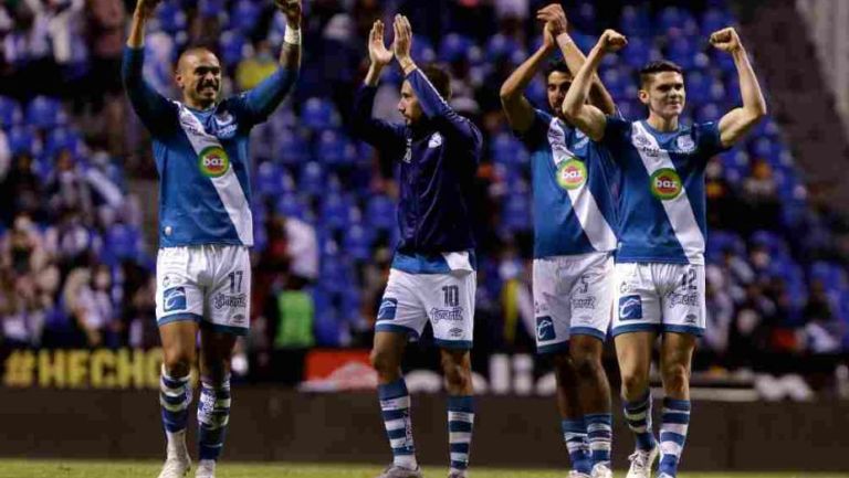 Puebla celebrando el triunfo ante Rayados 